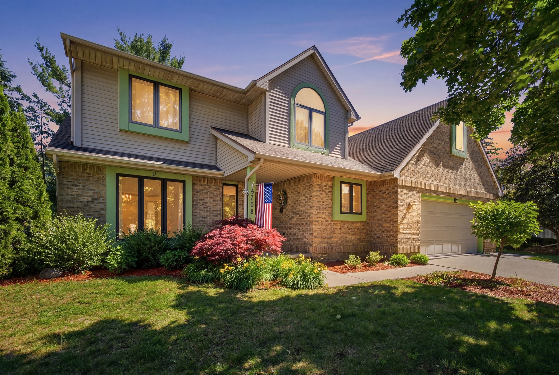 4708 Trail Wood Cir N, Midland MI twilight exterior